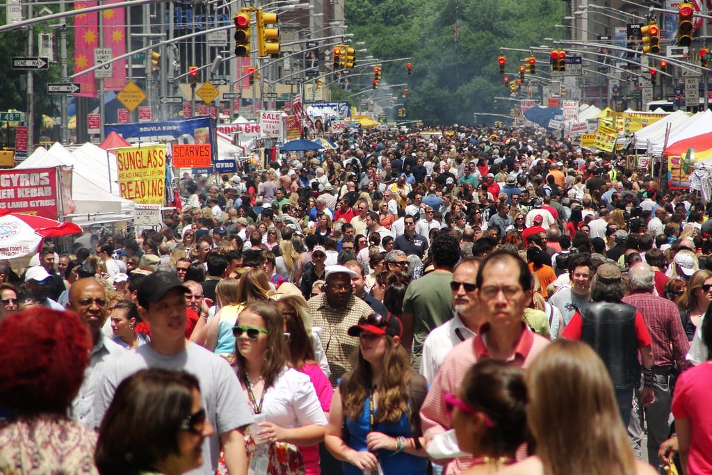 Pedestrians take over New York City's Sixth Avenue for the International Street Fair. 