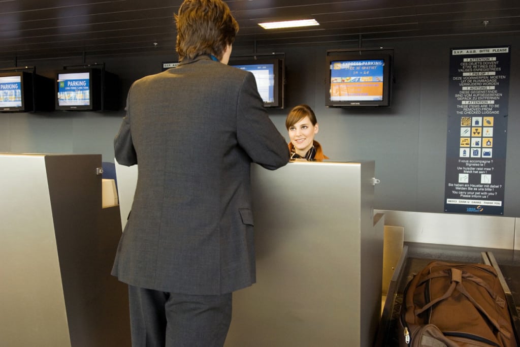 Businessman at an airport check-in counter. 