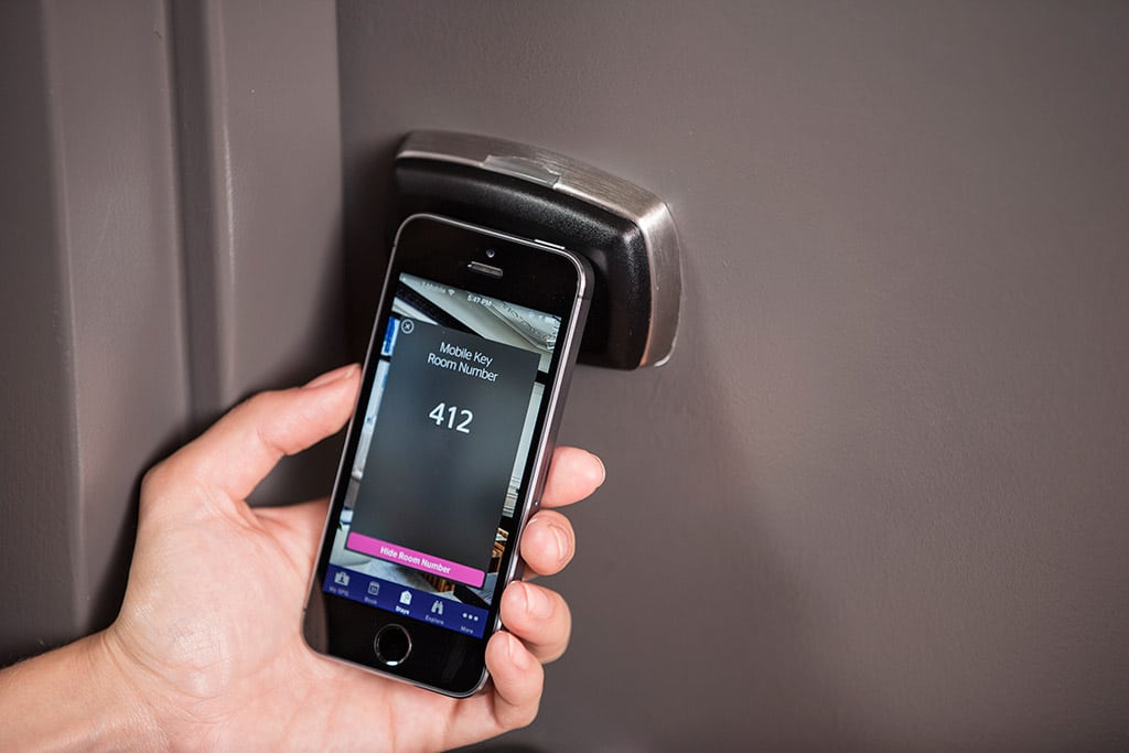 Hoteliers may try to counter the growth of Airbnb with enhanced digital services. Pictured is keyless entry with a mobile phone at an Aloft property.