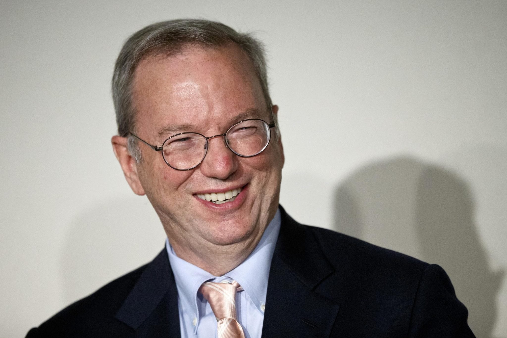 Google Executive Chairman Eric Schmidt smiles during a meeting about the 