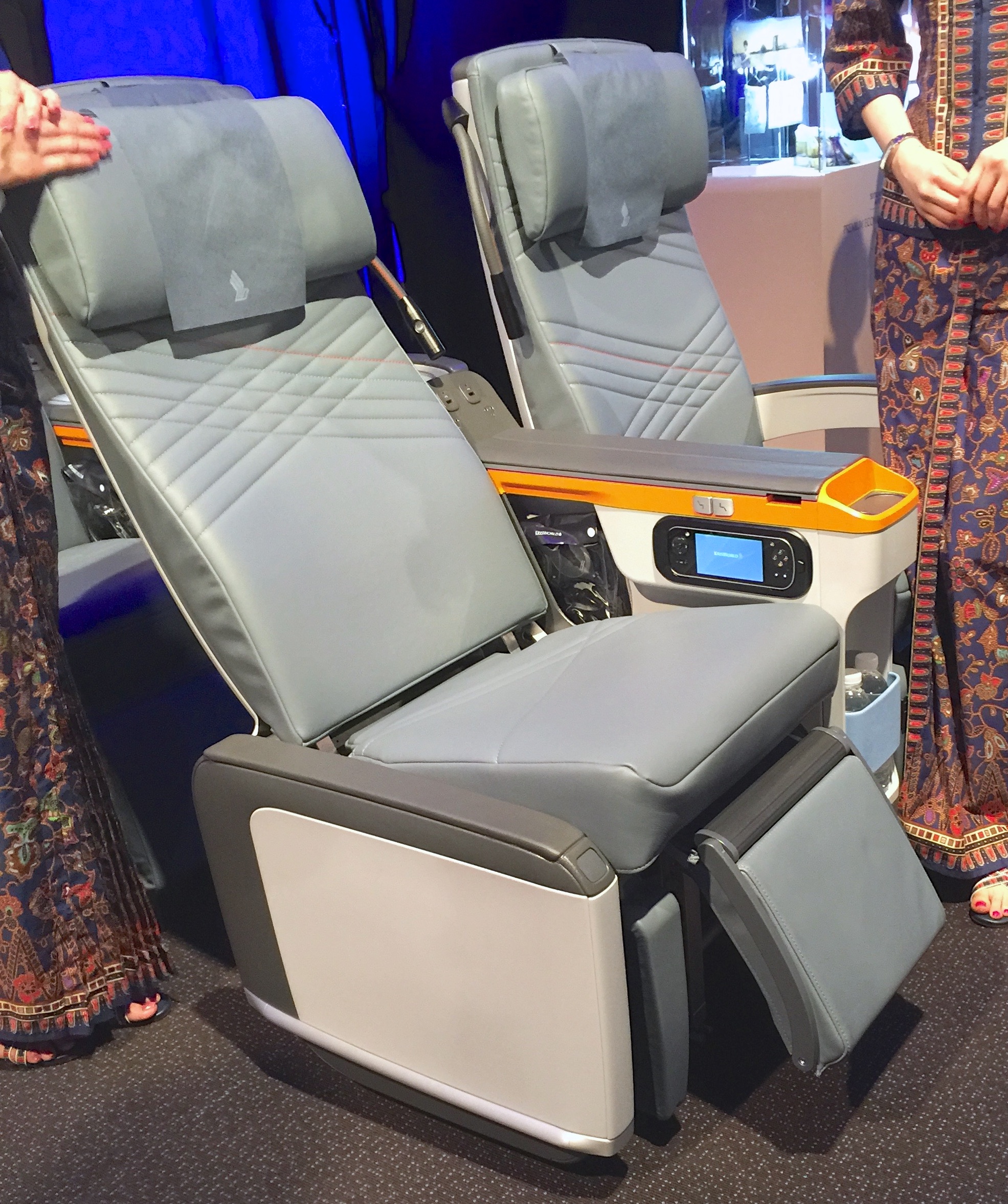 The outer armrest on Singapore Airlines' Premium Economy aisle seats can be lowered to make access easier and provided added seat width as needed/FCMedia