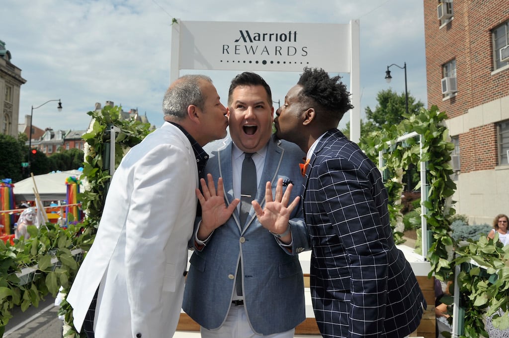 TV celebrity Ross Mathews (center) officiated the wedding of George Carrancho (left) and Sean Franklin (right) during the Marriott-sponsored 2015 Capital Pride Parade in Washington D.C. last June. LGBT travelers recently surveyed said Marriott did the best job at outreach to that community during the past year. 