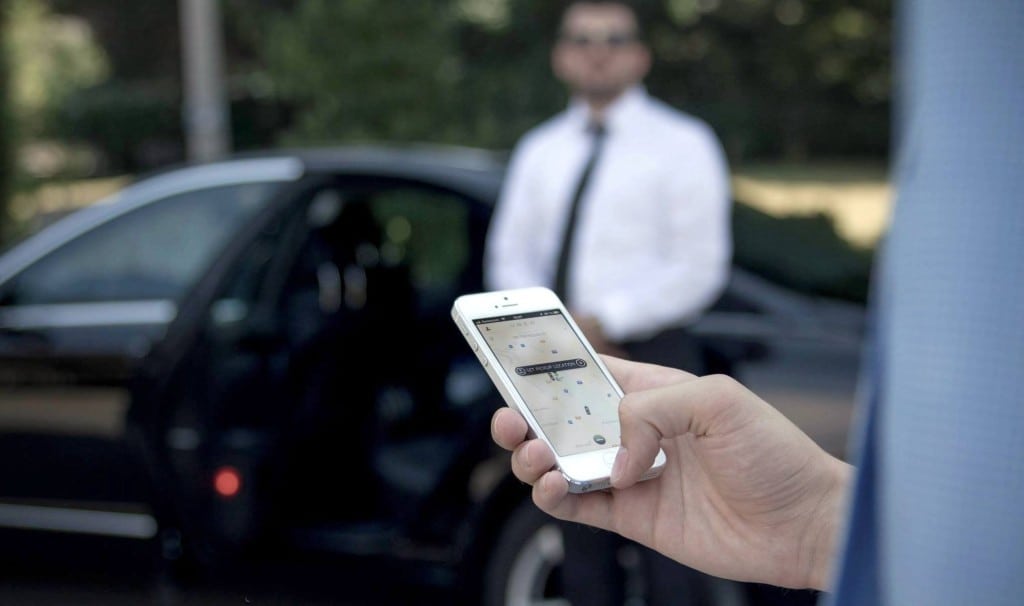 A user and an Uber driver in a promotional image. 
