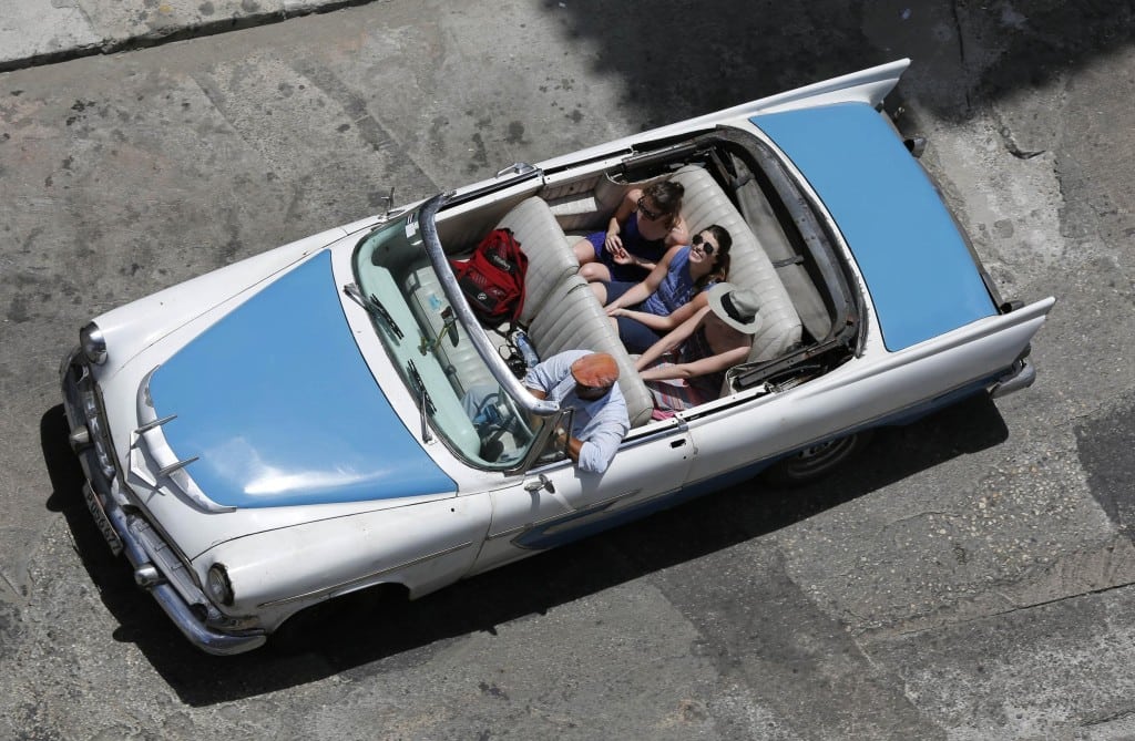 Tourists ride in an American car in Havana. Royal Caribbean Cruises just received permission from the Cuban government to sail to Havana on two cruise lines. 