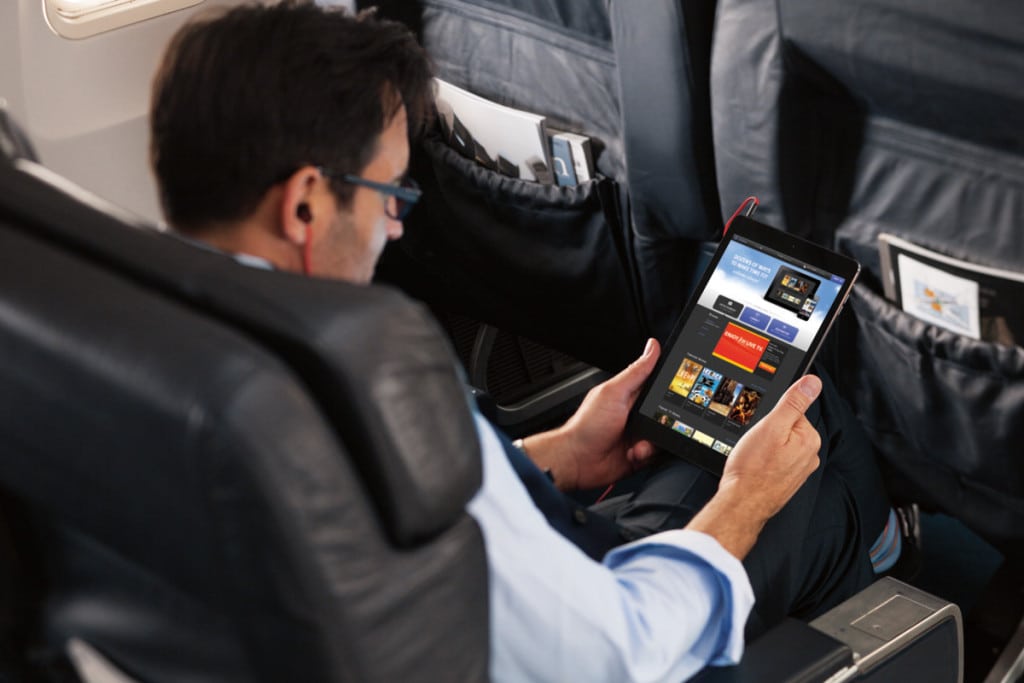 Global Eagle Entertainment's new Airtime Content-to-Go app lets travelers download in-flight entertainment content before their flights. Pictured here is a traveler using another GEE streaming service.