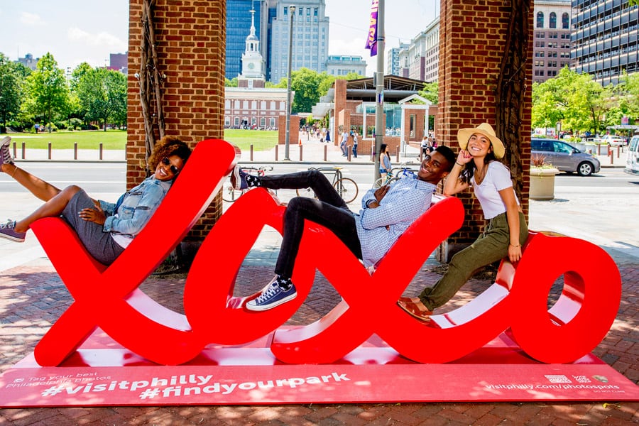 Visitors in Philadelphia interacting with a sculpture that came to life because of community engagement on Instagram.