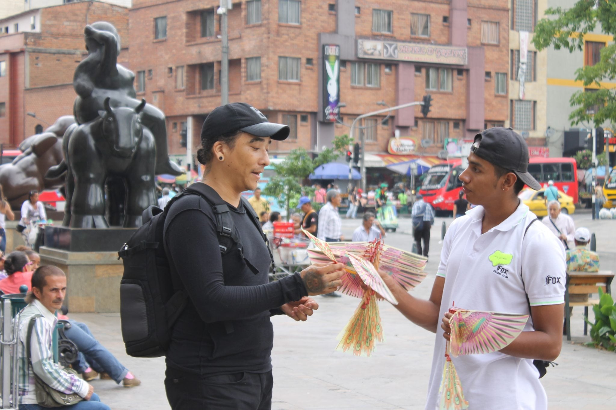 A tourist buying souvenirs in the city center of Medellin, Colombia.