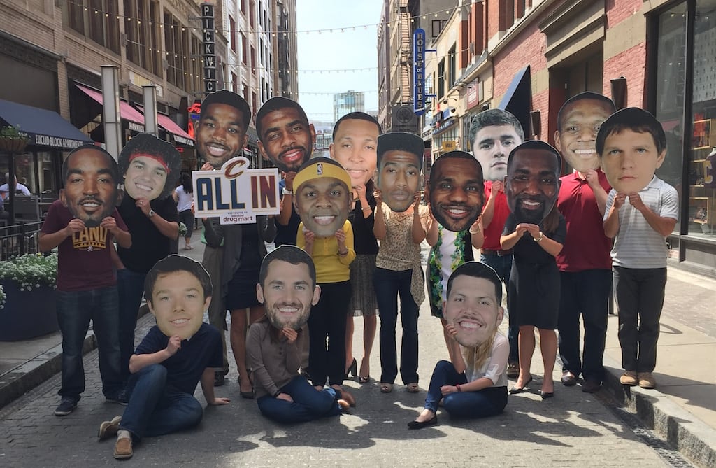 Destination Cleveland's staff pose with faces of the Cleveland Cavaliers during this year's NBA finals.