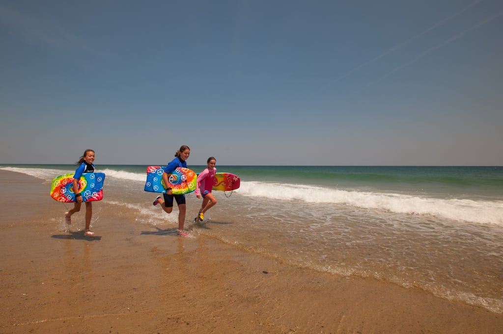 Young travelers enjoy Nauset Beach in Orleans, Massachusetts. 