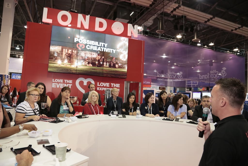 Meeting professionals watch a London & Partners presentation at IMEX America 2015.