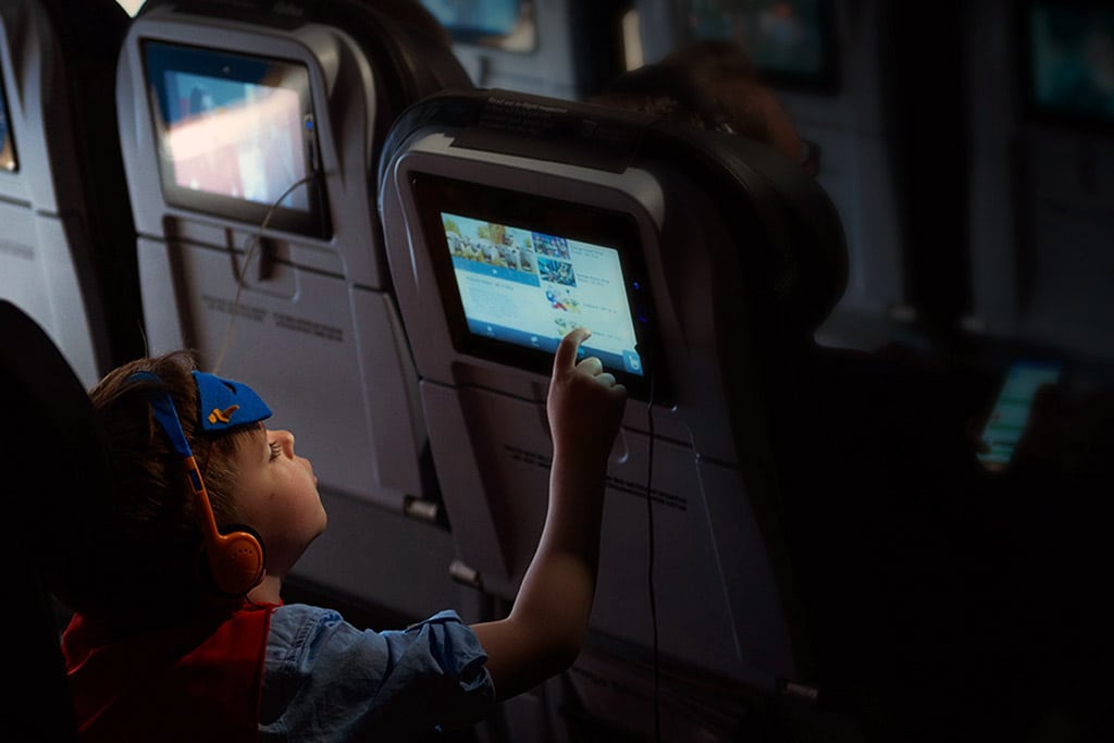 A child using in-flight entertainment on an Icelandair flight. 