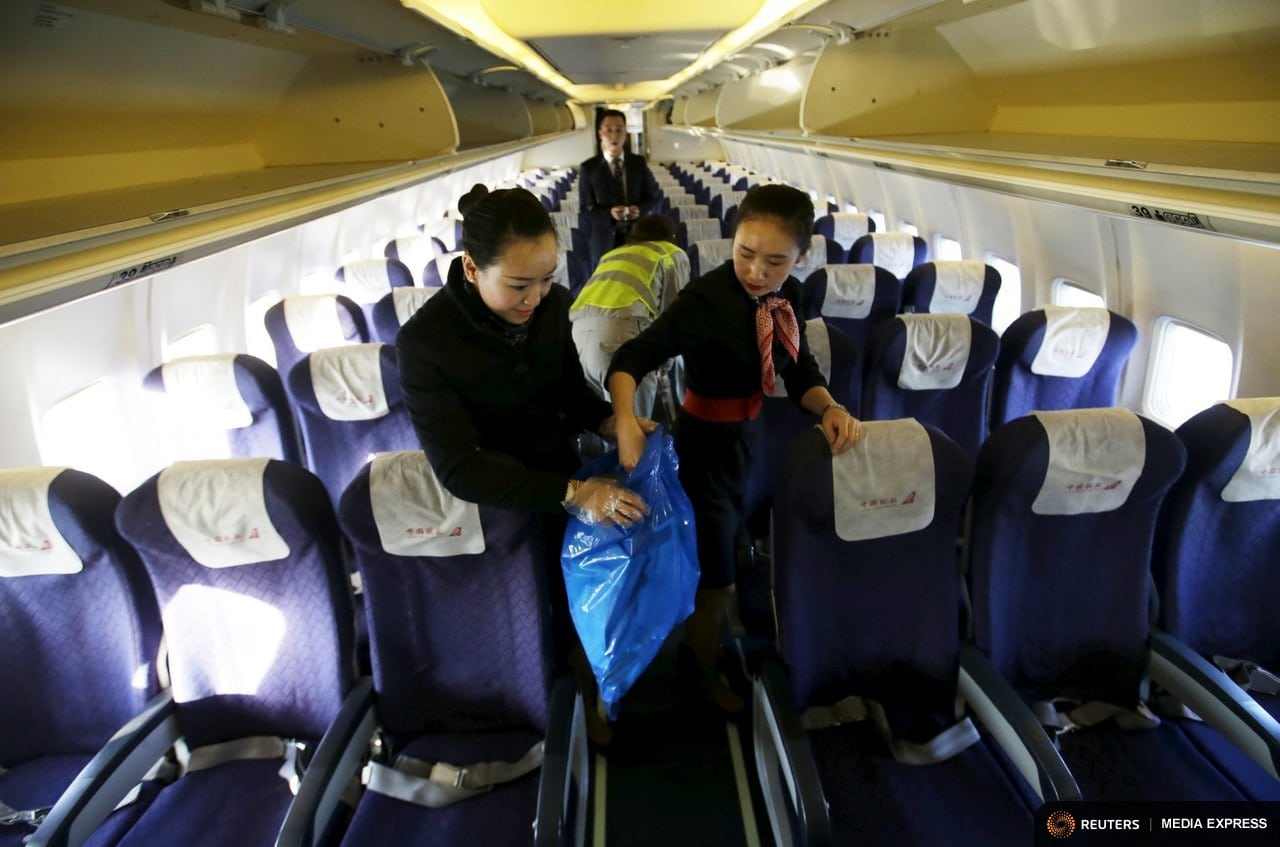 Business travel is expected to continue to grow this year after a rocky first few months. Flight attendants clean the cabin of a China United Airlines aircraft after it landed at the Nanyuan Airport in Beijing, China.