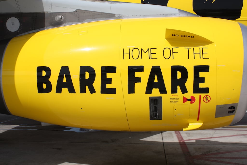 A marketing slogan on the side of a Spirit Air aircraft engine. 