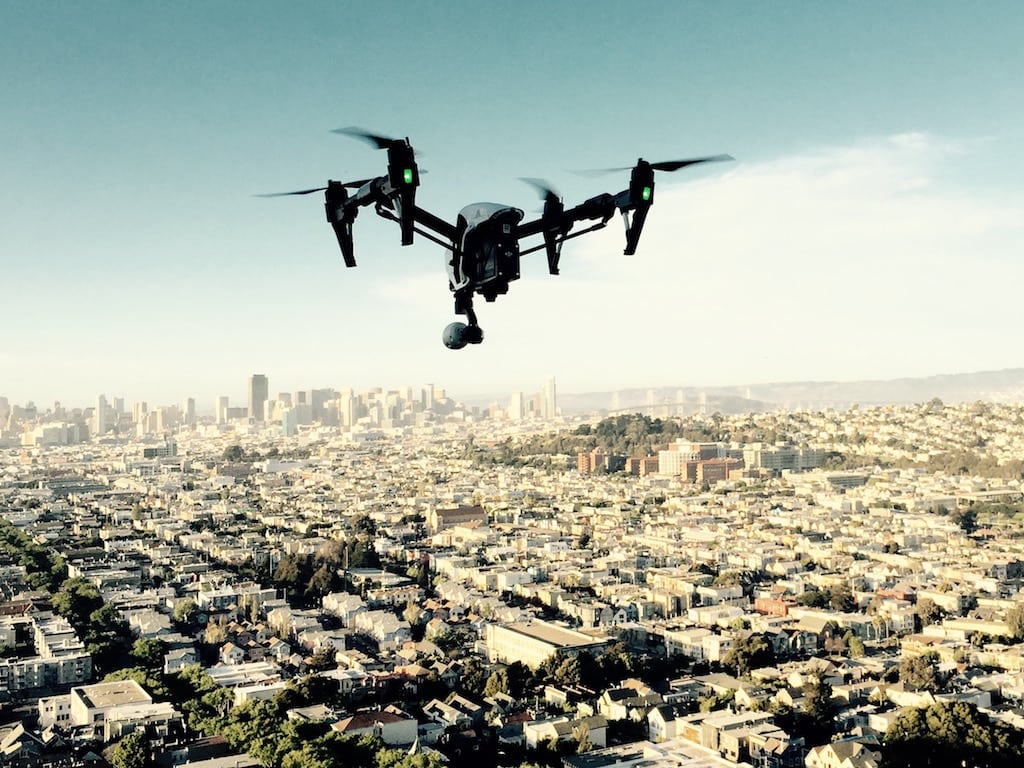 An unmanned drone hovers over San Francisco in March 2015.