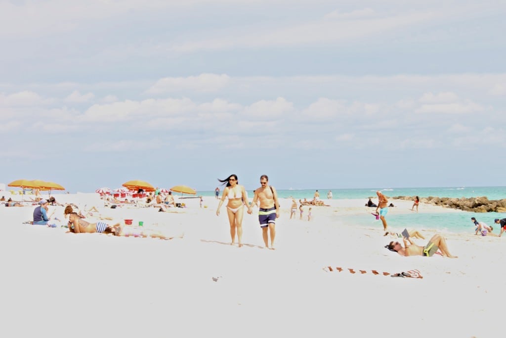Tourists enjoy a sunny day in Miami Beach, Florida.
