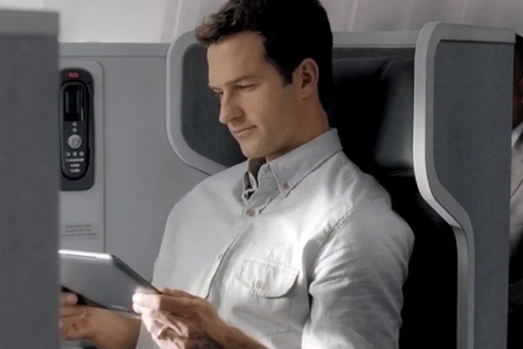 A passenger using a tablet device on American Airlines. 