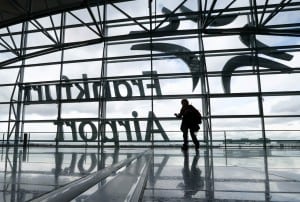 A passenger walks through a terminal during a strike at Frankfurt airport