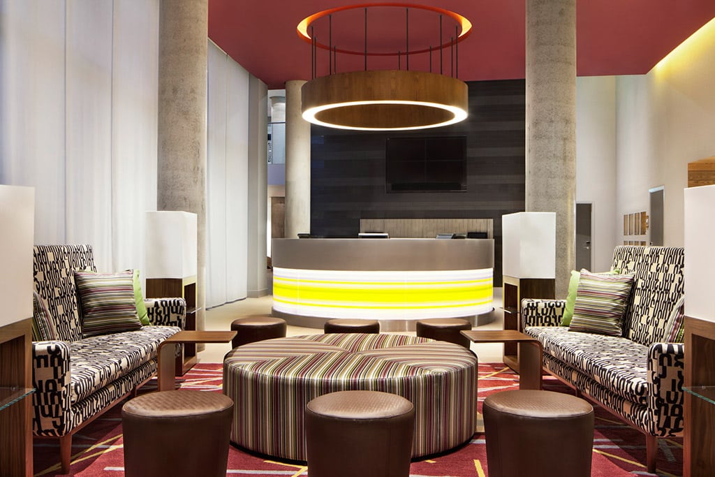 The concierge desk at the Aloft London. Anbang made a counteroffer today to acquire Starwood. 