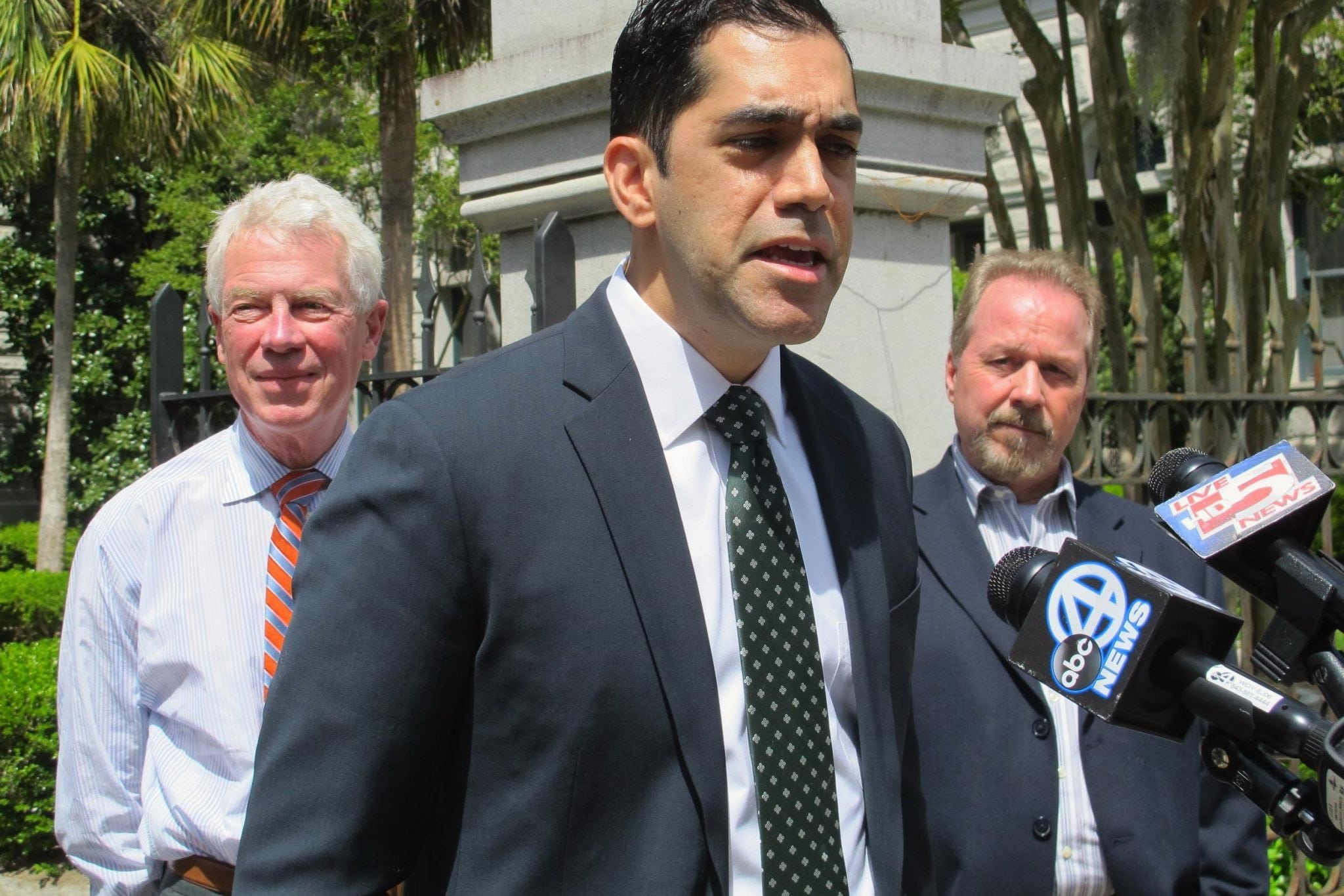 Attorney Arif Panju speaks with reporters outside the U.S. Courthouse in Charleston, S.C., on Tuesday, April 19, 2016. Behind Panju are Michael Nolan, left, and Michael Warfield, two of the three plaintiffs suing the city over the ordinance they claim violates their rights to free speech. 
