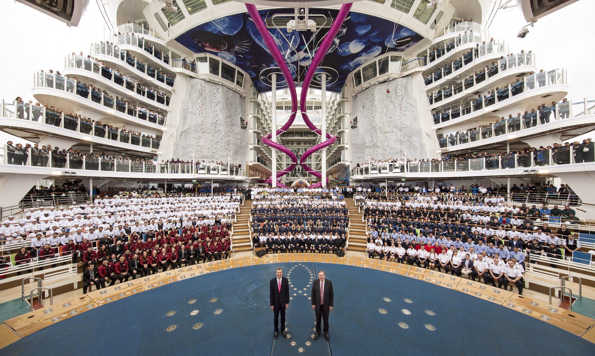 Royal Caribbean International CEO Michael Bayley, front left, with Royal Caribbean Cruises Chairman and CEO Richard Fain and crew aboard the new Harmony of the Seas. 