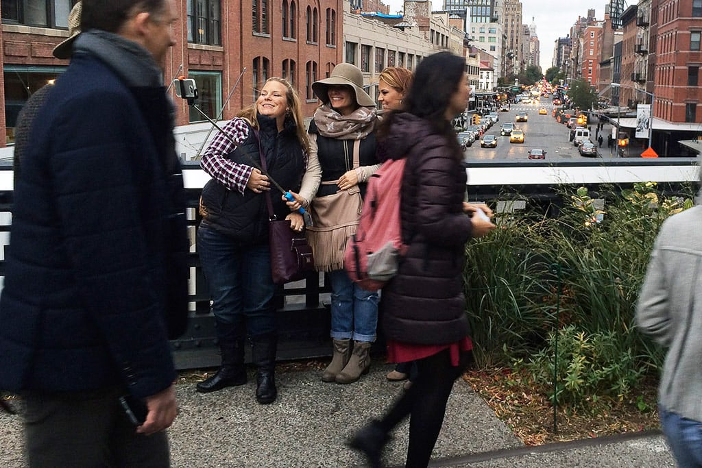 Tourists taking a selfie on New York City's High Line. 