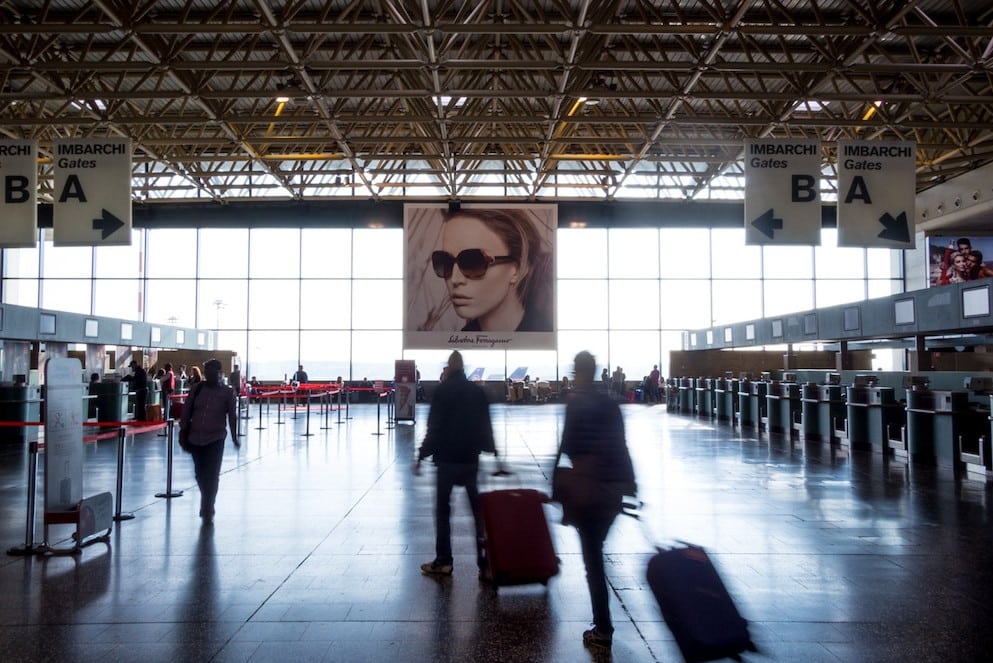 Travelers at Milan's Malpensa Airport in 2013.