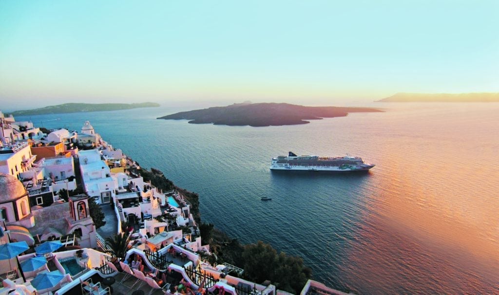 Norwegian Jade sails by Santorini in Greece.