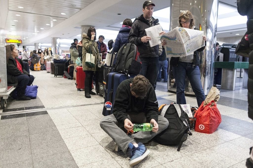 Airfares from U.S. airlines are likely to be soaring in the next few months. Pictured, people wait for their delayed flights at LaGuardia Airport in New York January 3, 2014.