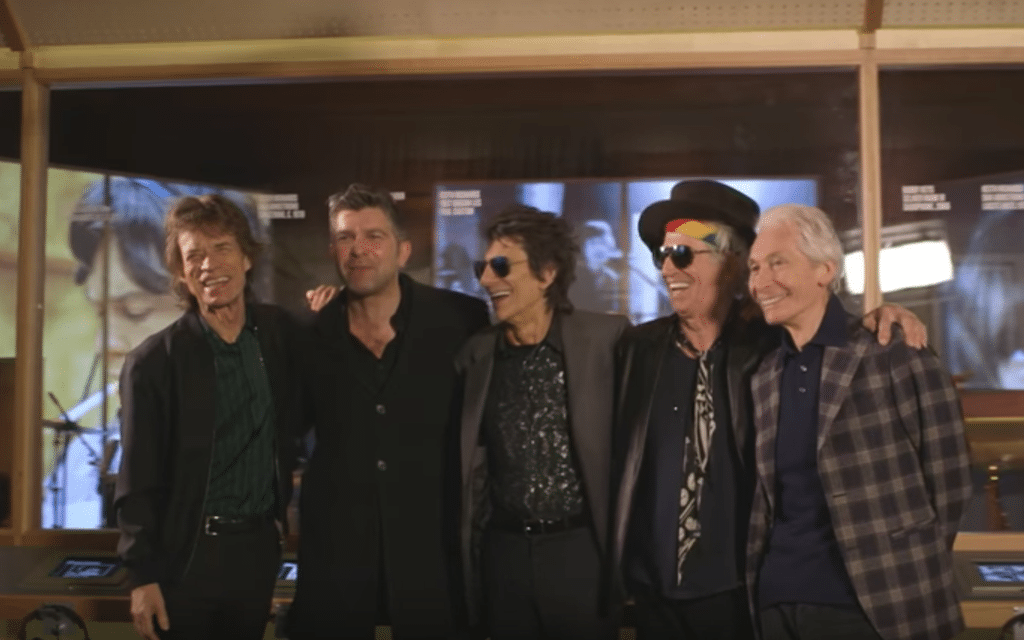 The Rolling Stones with American fan Alex Emanuel, second from left, at the Rolling Stones Exhibition at London’s Saatchi Gallery as part of a tourism promotion. 