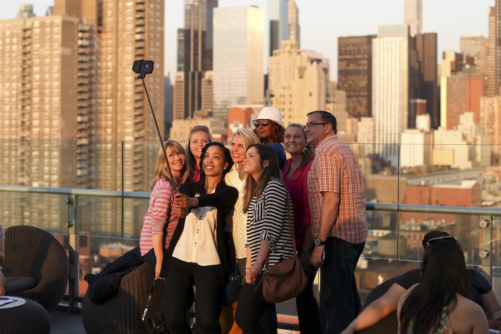Tourists taking a selfie on a New York City rooftop in 2015.