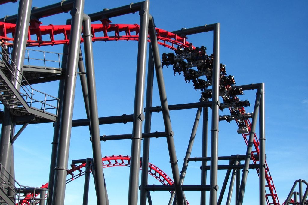 Visitors ride a roller coaster at Six Flags Magic Mountain.