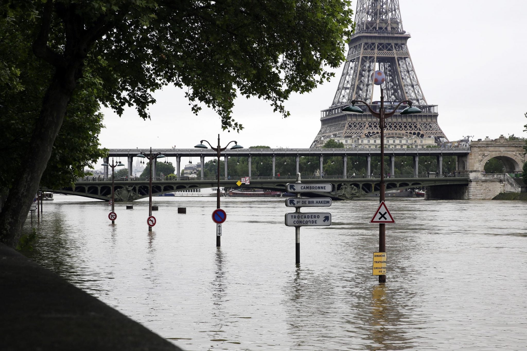 View of the flooded banks of the river Seine in front of the Eiffel tower in Paris, Friday, June 3, 2016. Both the Louvre and Orsay museums were closed as the Seine, which officials said was at its highest level in nearly 35 years, was expected to peak sometime later Friday. 