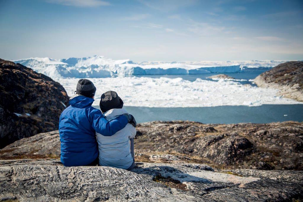 A Chinese investment group is acquiring Abercrombie & Kent. Pictured are two hikers on an Abercrombie & Kent trip near the Ilulissat Icefjord fjord in western Greenland. 