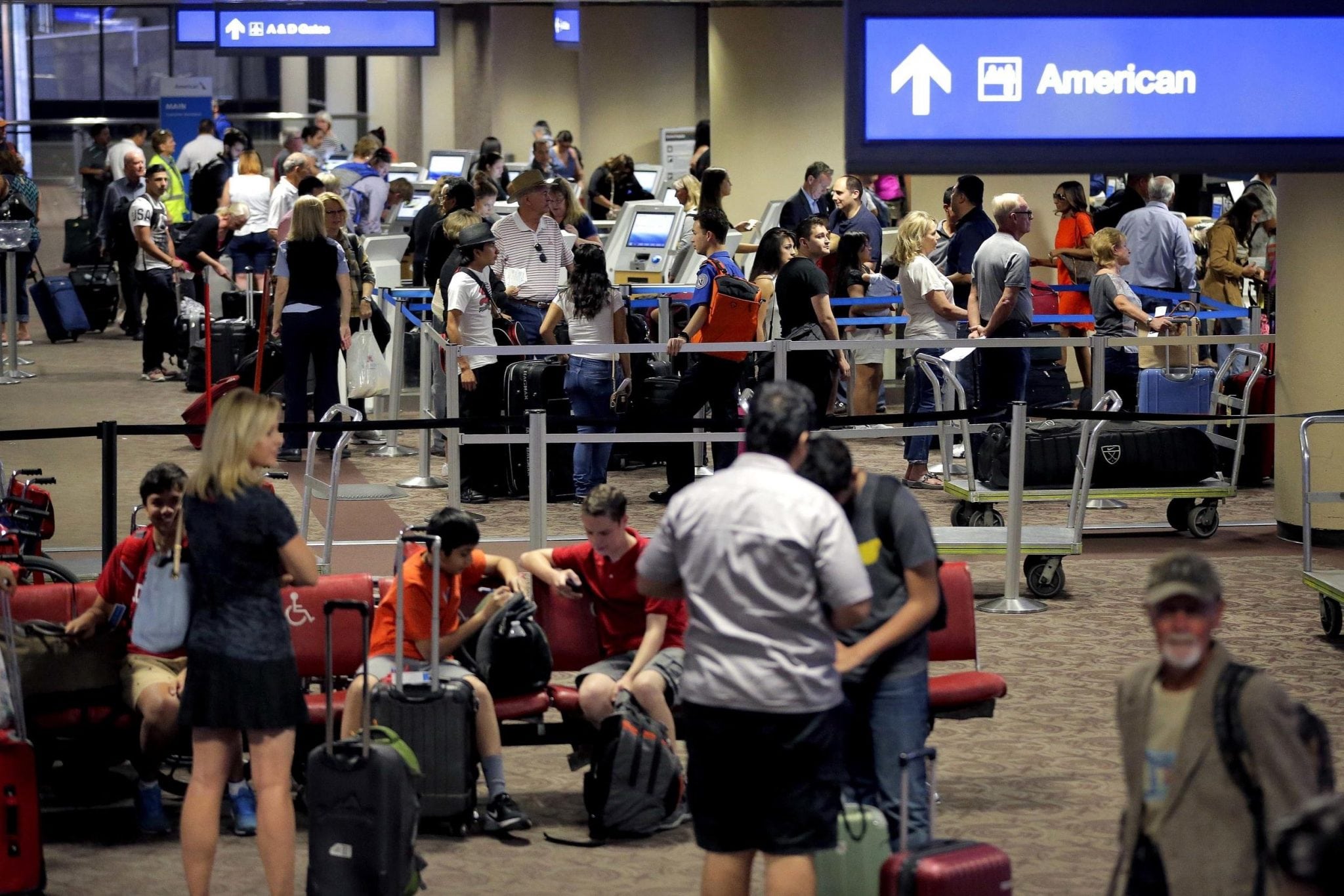 Passengers line up to check in before their flight at Sky Harbor International Airport in Phoenix. 