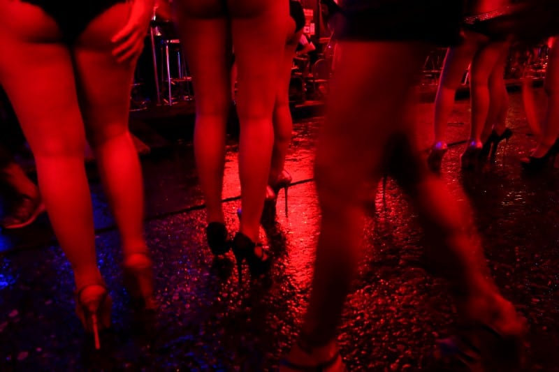 Women stand outside a bar in a red light district in Bangkok, Thailand. The tourism ministry says it wants to reduce sex tourism numbers. 