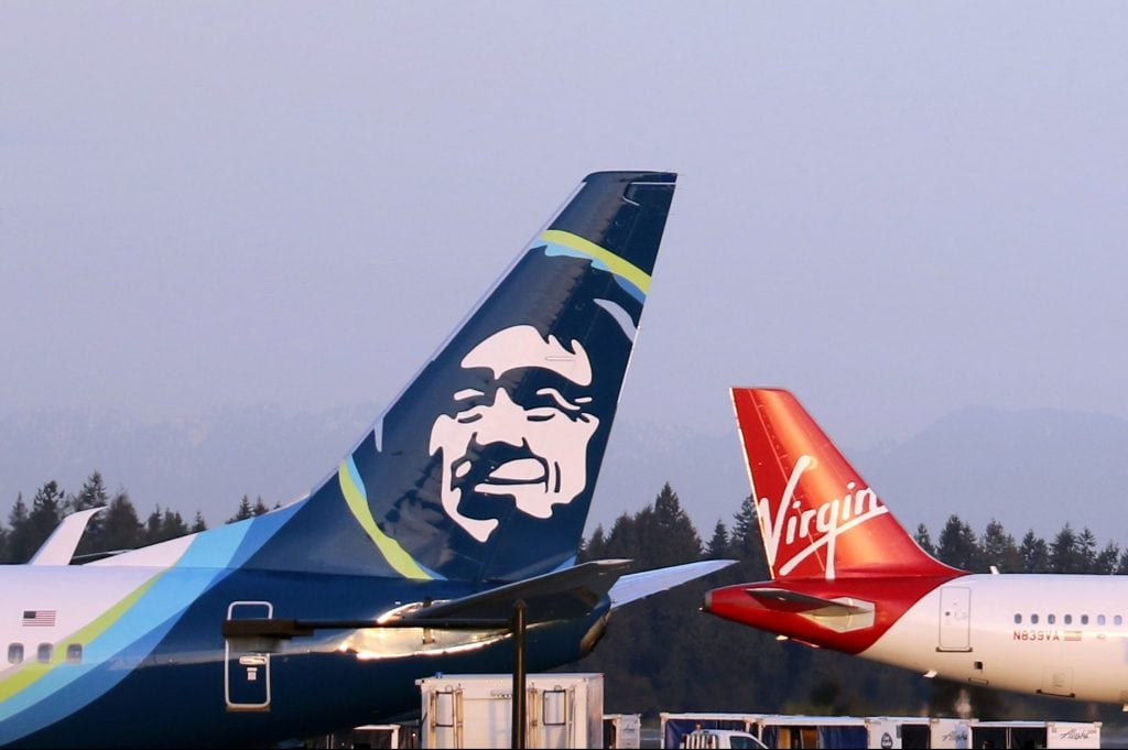 Google is offering a flight price guarantee on certain Alaska Airlines (foreground) routes. 