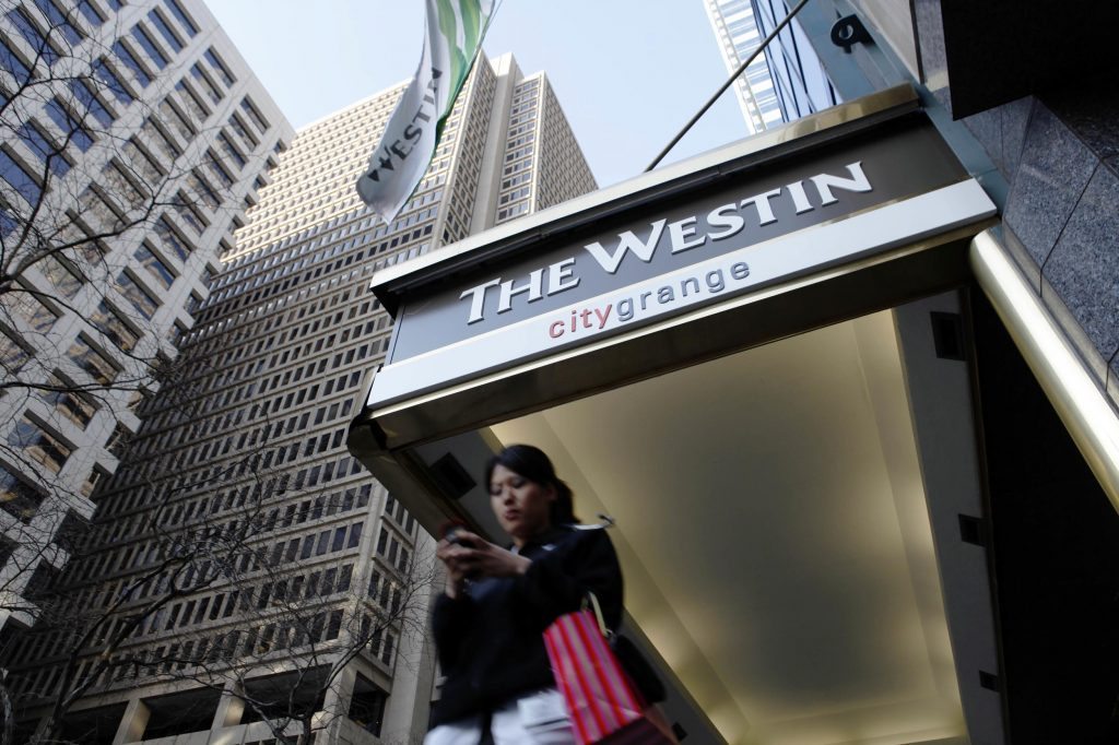 Travel managers are trying to find the best way to deal with travelers who book direct. Here, a woman is shown by the Westin hotel in Philadelphia. 