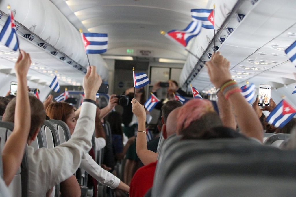 Passengers celebrate on JetBlue's first scheduled flight to Cuba on August 31, from Fort Lauderdale to