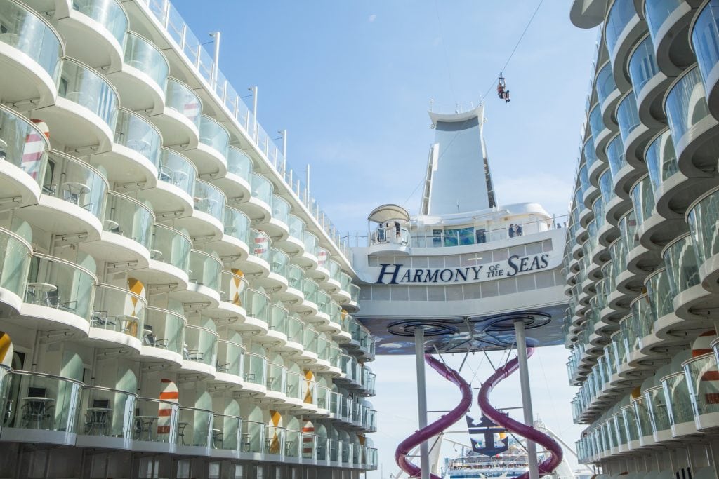 Royal Caribbean International's Harmony of the Seas is shown in Barcelona. The cruise line's parent company released positive third-quarter earnings Friday.
