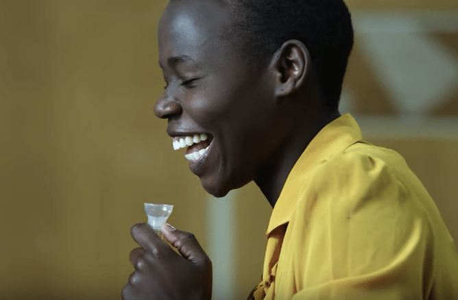 A woman takes a DNA test in a Momondo video that promotes heritage tourism.