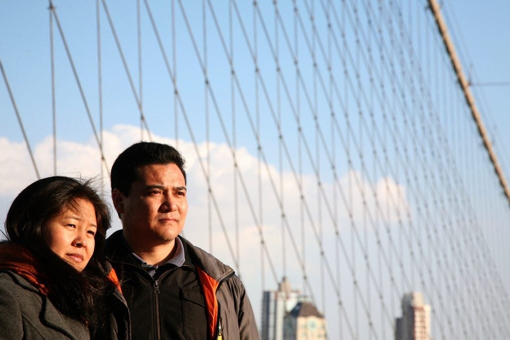 Ctrip not only wants to improve tours for Chinese tourists in the U.S. but also wants to sell travel from the U.S. to China and Southeast Asia. Pictured, tourists pose at the Brooklyn Bridge on January 30, 2011.