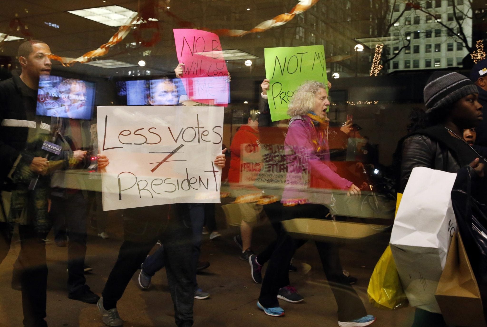 Protesters march in front of Trump Tower in downtown Chicago, criticizing the election of President-elect Donald Trump on Thursday, Nov. 10, 2016. 