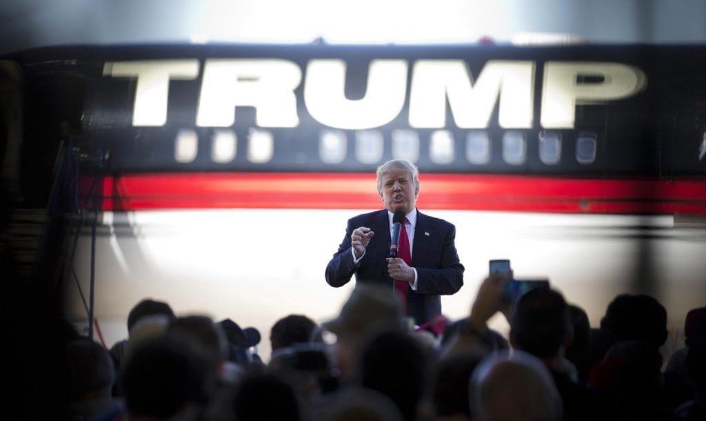 Donald Trump stands in front of his airplane as he speaks during a rally in Bentonville, Arkansas. Trump won the U.S. presidential election November 8.