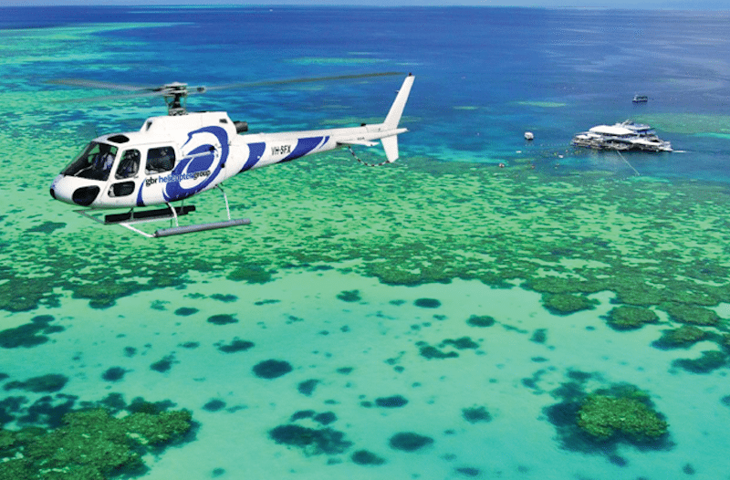 TripAdvisor is bringing in executives from its vacation rental business to run its attractions unit as veteran officials depart. Pictured is a helicopter taking in the Great Barrier Reef, Australia, an activity sold on Viator. 
