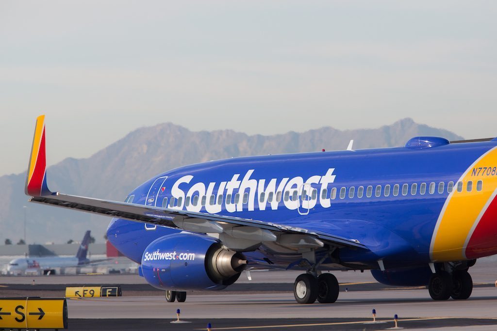 A Southwest plane is shown on the runway. The airline reported solid second-quarter earnings Thursday, though profits were down.