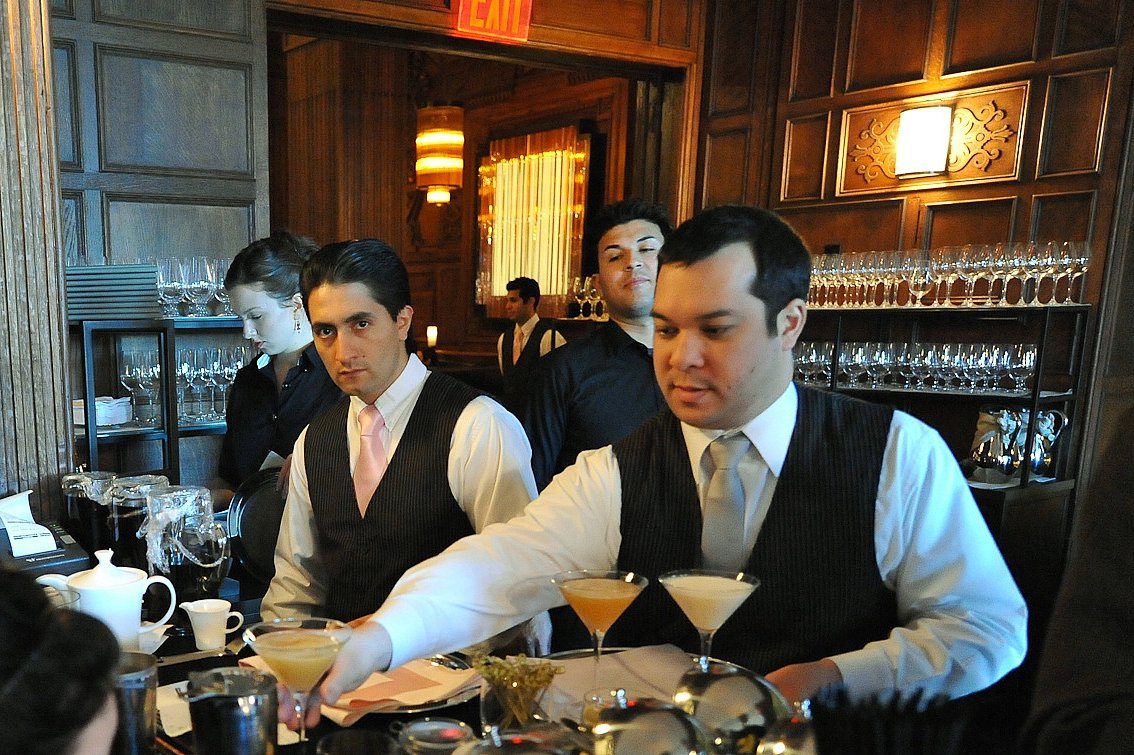The U.S. travel industry added about 33.3 percent fewer jobs in 2016 than were added in 2015. Pictured are waiters at the Plaza Hotel's Oak Bar in New York City.