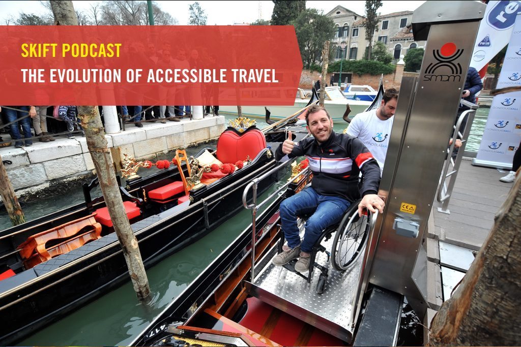 A man sitting on a wheelchair is boarded on a gondola in Venice, Italy through the Gondolas4All project that provides access points for wheelchair users.