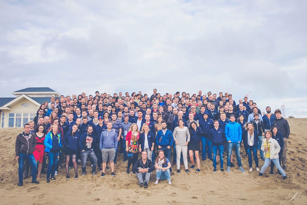 A photo of all of price-comparison website Trivago’s IT people during a three-day, off-site team meeting in Noordwijk, on the Dutch North Sea coast, in summer 2016. Trivago's CEO argues that such events are one reason why it outmaneuvers bureaucratic Google. 