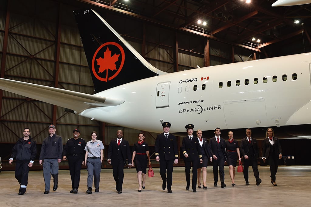 Air Canada staffers showing off new uniforms in 2017. CEO Calin Rovinescu announced he will retire in February 2021.