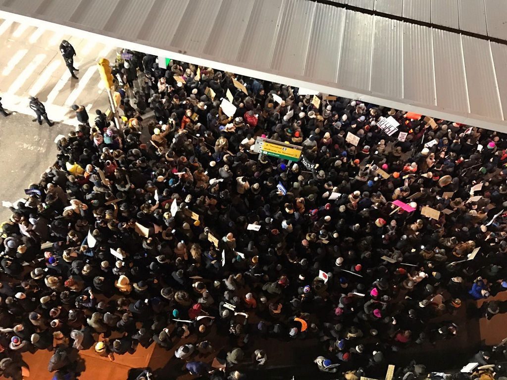 This photo shows protests at John F. Kennedy International Airport over the Trump administration's first travel ban in January. The ban — a third version of which was allowed to go into effect late in the year — was one of many disruptive forces in business travel in 2017.
